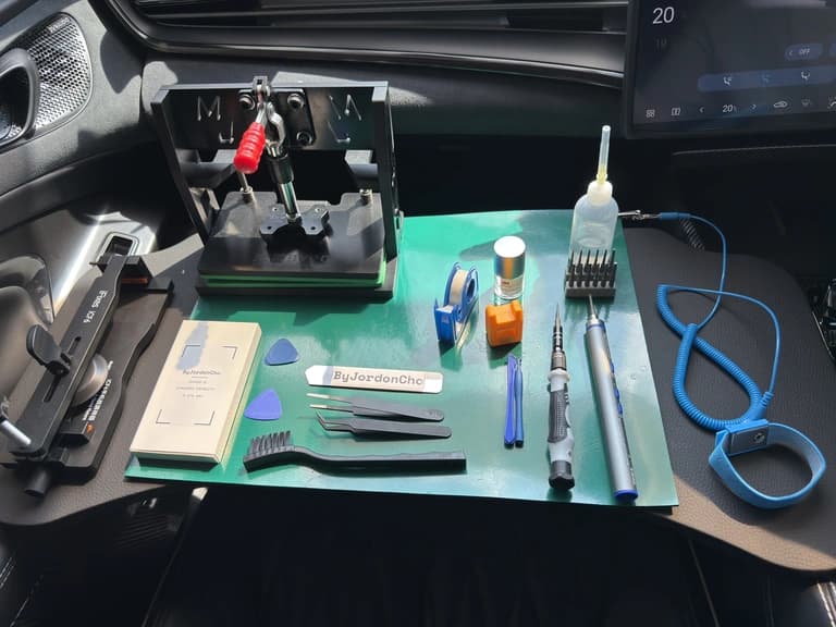 Mobile cleanroom workstation setup showing ESD-Safe mat, calibrated tools, and overhead camera inside BYD Seal